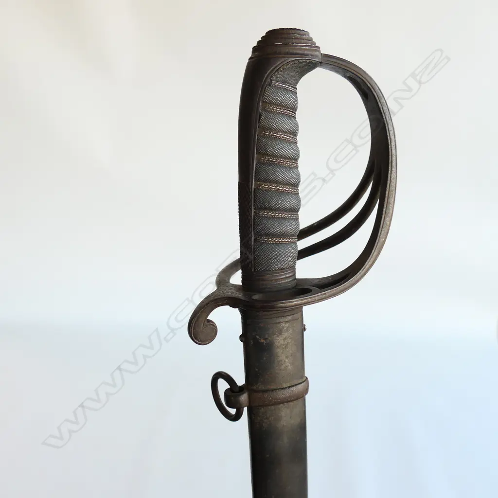 An 1821 Pattern Royal Artillery Officer's sword with steel scabbard, the 'three bar' hilt with open swept guard and sharkskin wire bound grip. Image 1++