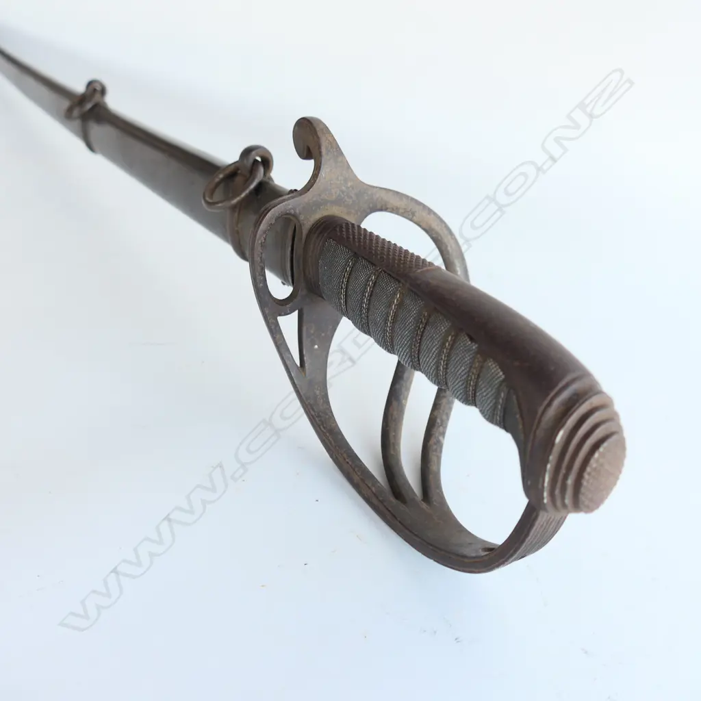 An 1821 Pattern Royal Artillery Officer's sword with steel scabbard, the 'three bar' hilt with open swept guard and sharkskin wire bound grip. Image 1++