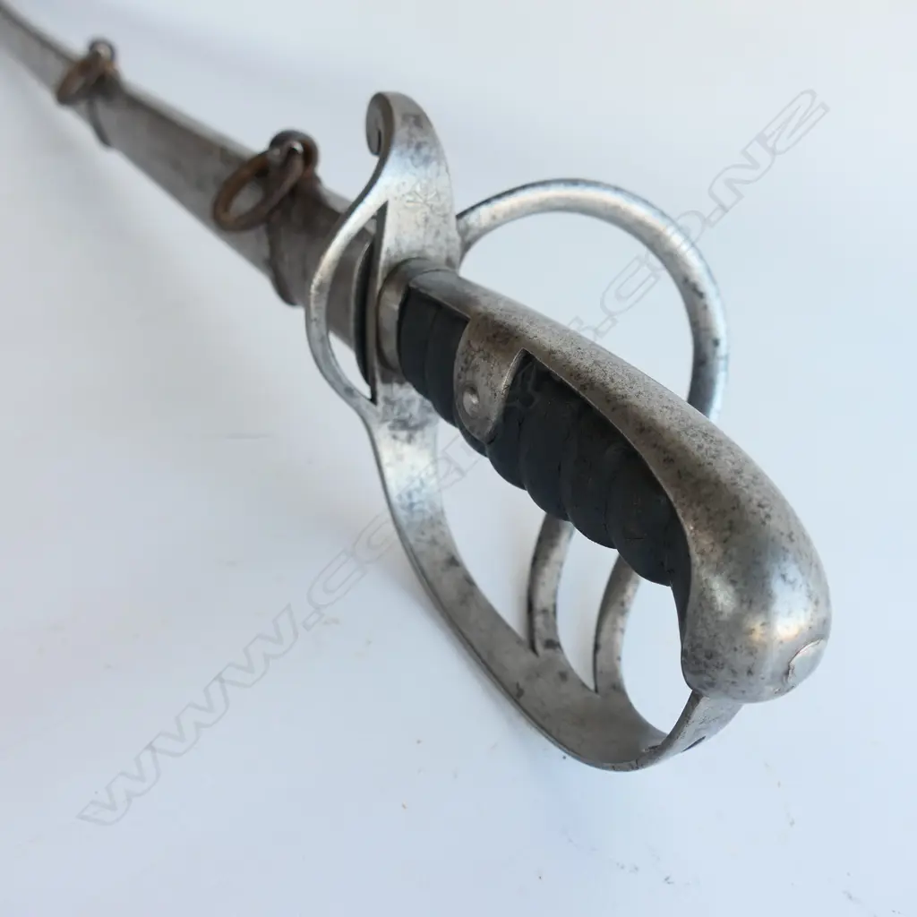 A Light Cavalry Trooper's sabre and steel scabbard,1821 pattern, with 890mm slightly curved single fullered, spear pointed blade, Image 1++