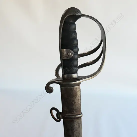 A Light Cavalry Trooper's sabre and steel scabbard,1821 pattern, with 890mm slightly curved single fullered, spear pointed blade,