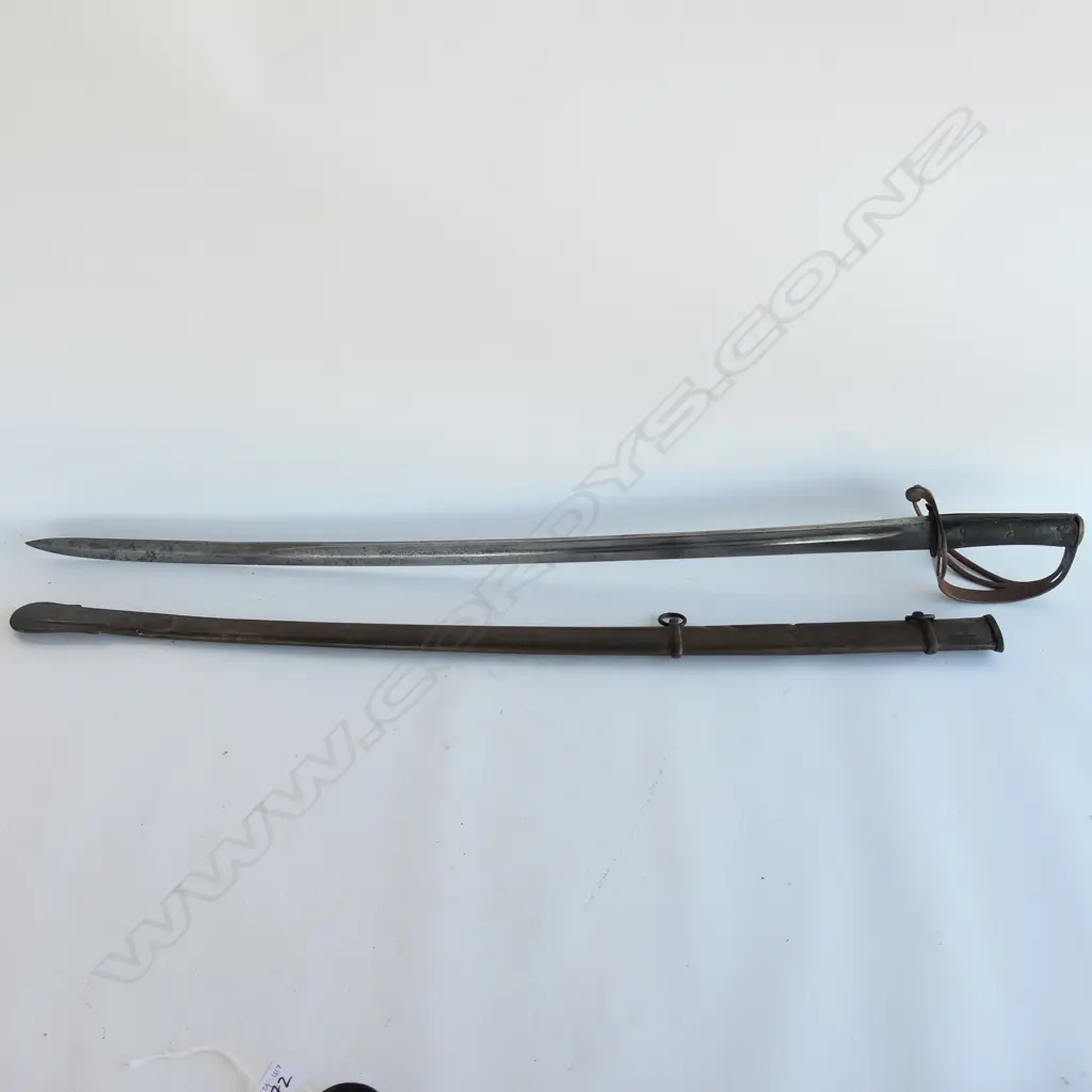 An 1853 Pattern Cavalry Trooper's sword and scabbard, the 895mm single edge fullered steel blade stamped to back edge ‘Mole’ for Robert Mole, Birmingham, Image 1++