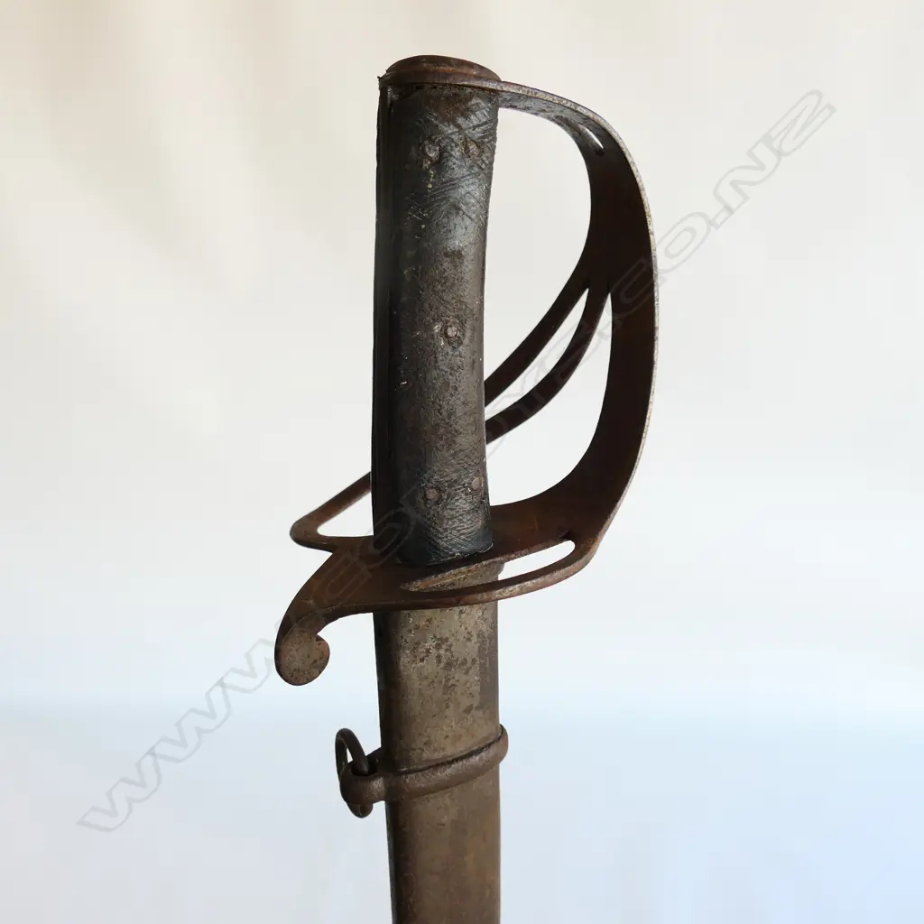 An 1853 Pattern Cavalry Trooper's sword and scabbard, the 895mm single edge fullered steel blade stamped to back edge ‘Mole’ for Robert Mole, Birmingham, Image 1++