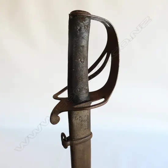 An 1853 Pattern Cavalry Trooper's sword and scabbard, the 895mm single edge fullered steel blade stamped to back edge ‘Mole’ for Robert Mole, Birmingham,