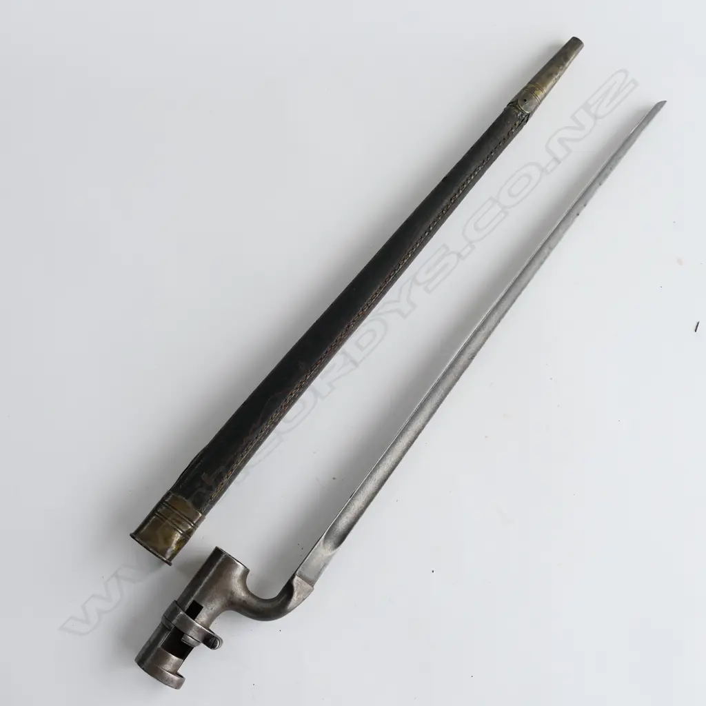 British 1853 Enfield Triangular Socket Bayonet (‘74’) and Scabbard (‘WD broad arrow 1788’), brass mounted black leather scabbard with chape glued. Image 1++