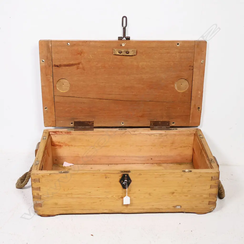 A late 19thC military pine military equipment box, one of the dovetailed corners stamped with serial numbers and other markings, with rope handles to either end, the hinged lid with morticed, clenched ends and provision for screw downs to all edges and additionally a (later) steel clasp lock. 710 x 390 x 230mm. Image 1++