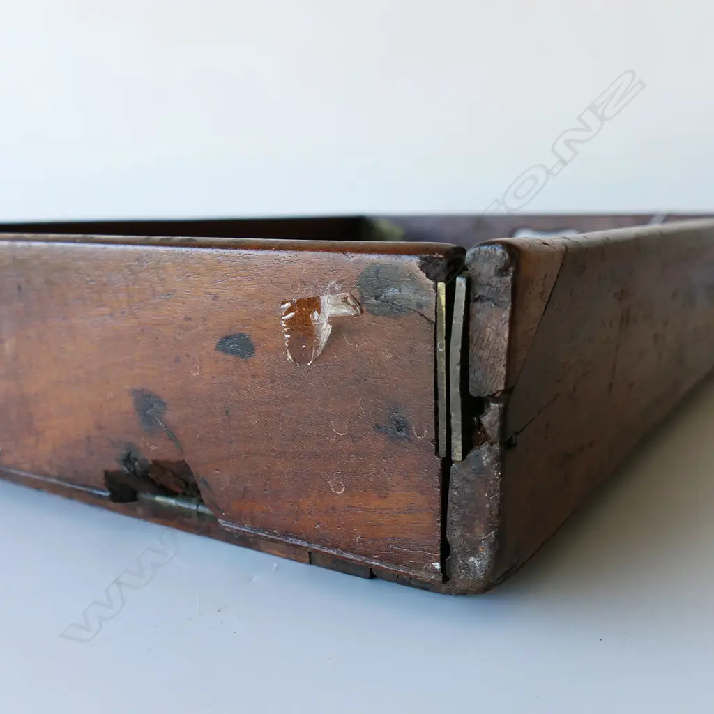 A 19thC teak campaign butler's tray table- the two-handled folding top with brass hinges supported on folding X-framed base. 770 x 510mm Image 1++
