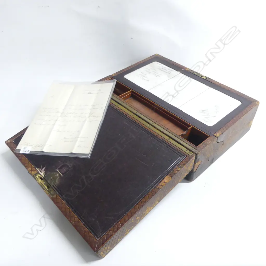 An early 19thC writing box, with chequered leather covering, fitted mahogany interior including uncommon porcelain slates. Eexterior distressed. 370 x 260 x 140mm. Image 1++