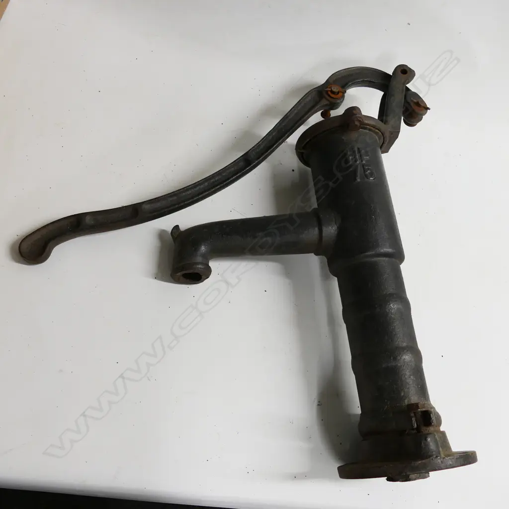 A cast iron water pump body and handle, marked HP75. Requires reassembly with rod and diaphragm. H.560mm Image 1++