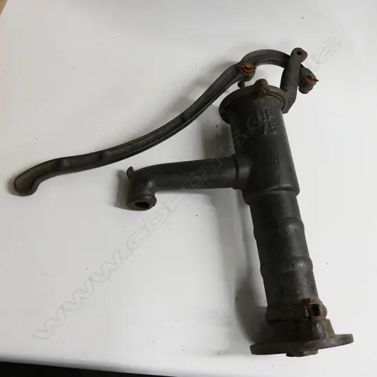 A cast iron water pump body and handle, marked HP75. Requires reassembly with rod and diaphragm. H.560mm