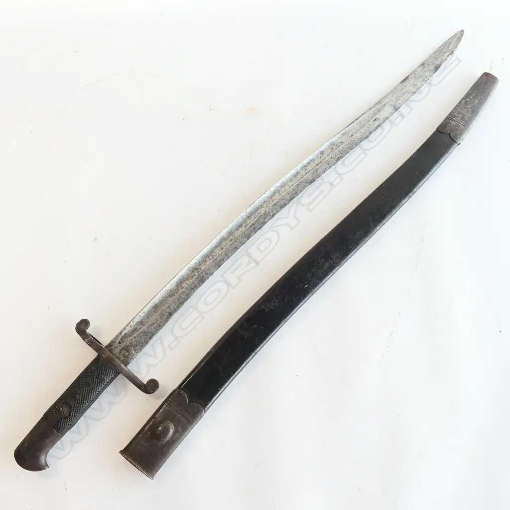 British P.1856/58 Sword Bayonet. As issued with blade and metal parts with stained aged appearance. Sound black leather and steel scabbard. Image 1++