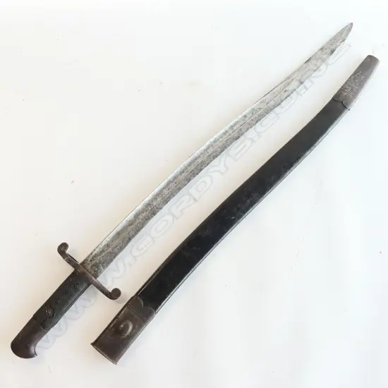 British P.1856/58 Sword Bayonet. As issued with blade and metal parts with stained aged appearance. Sound black leather and steel scabbard.