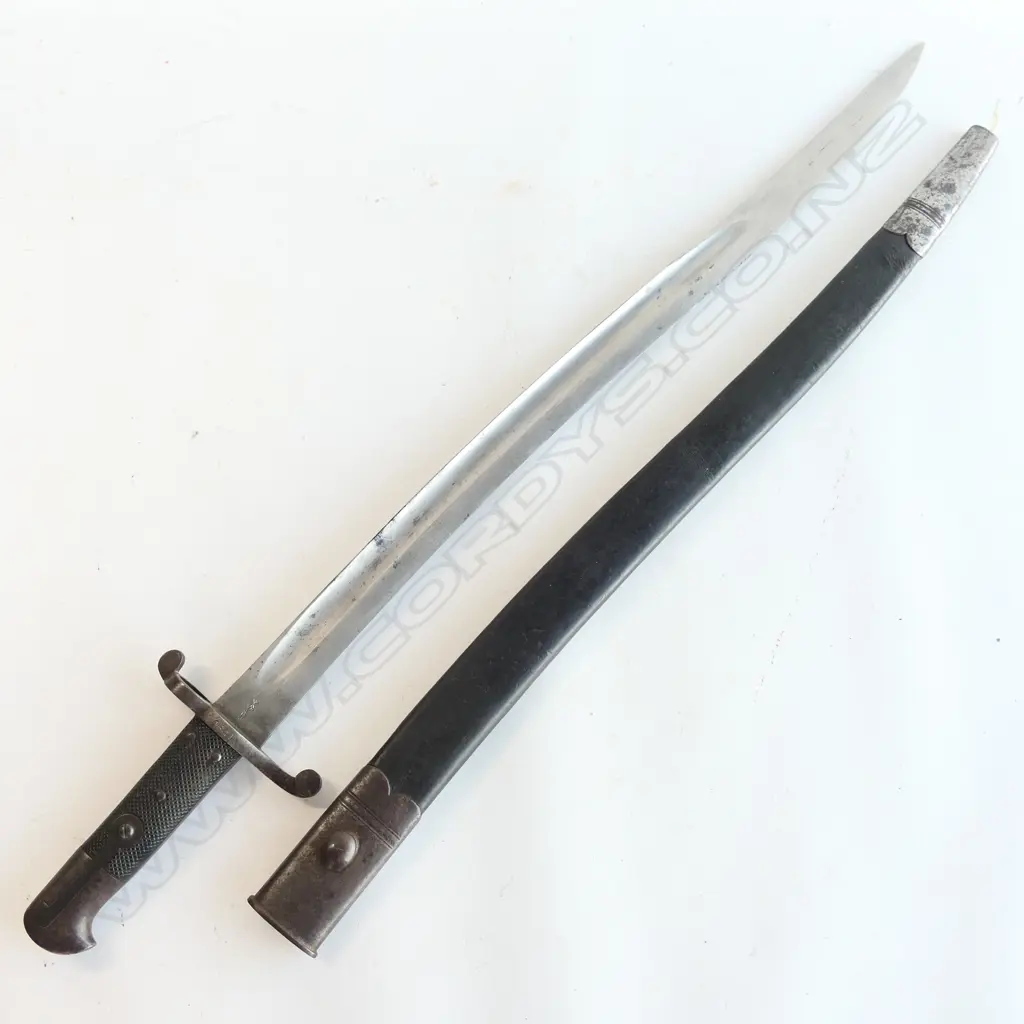 British P.1856/58 Sword Bayonet with leather scabbard, Yataghan blade with ‘WD’ and armoury markings at ricasso, number ‘0641’ on crossguard. Isolated pitting, good grips. Image 1++