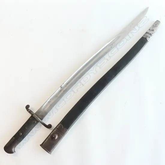 British P.1856/58 Sword Bayonet with leather scabbard, Yataghan blade with ‘WD’ and armoury markings at ricasso, number ‘0641’ on crossguard. Isolated pitting, good grips.
