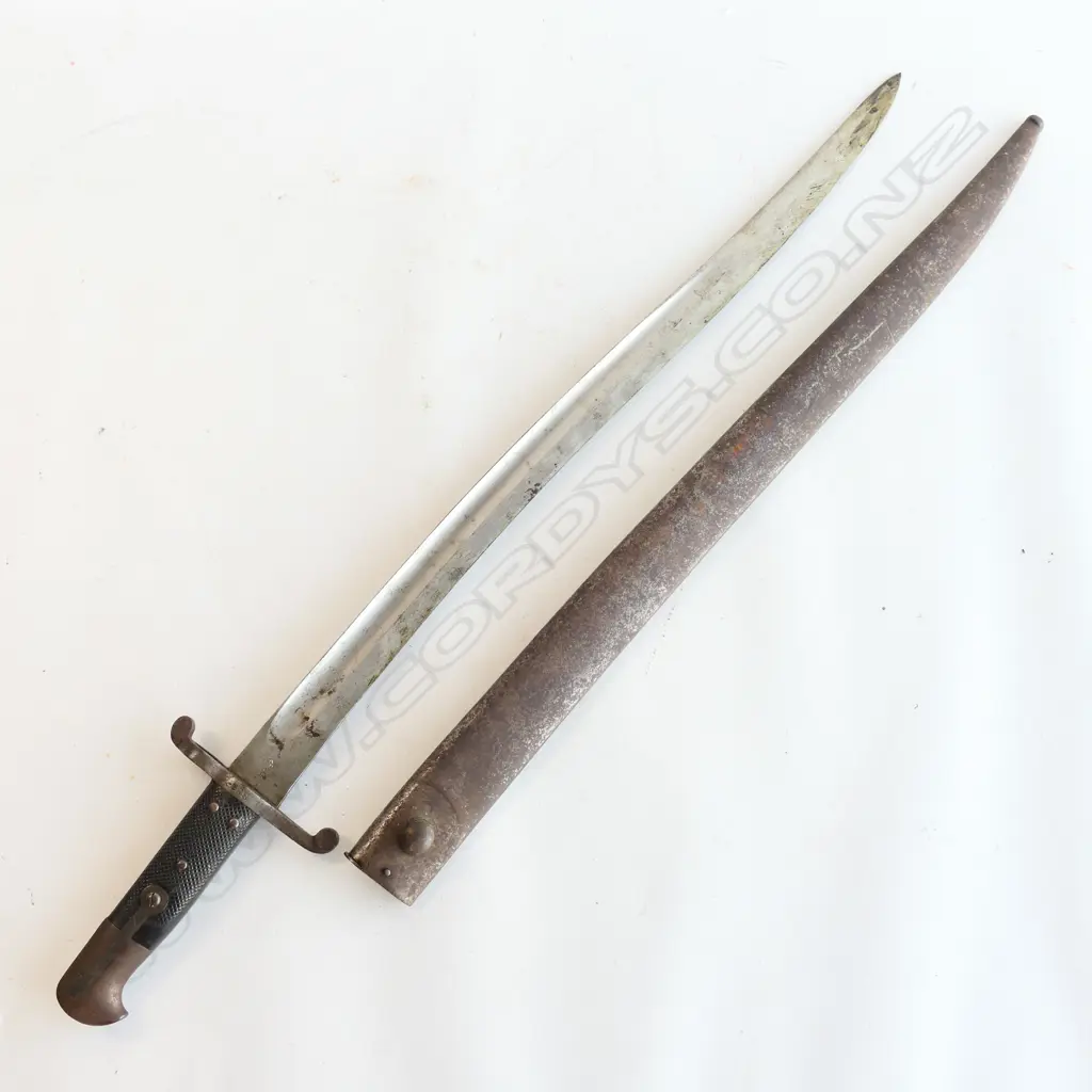 British P 1856/58 Sword Bayonet and Steel Scabbard, good leather grips. Yataghan blade in very good condition, Kirschbaum maker's logo and ‘WD’ armoury marks at ricasso, over stamped number ‘288’ at crossguard. Scabbard with surface rust. Image 1++