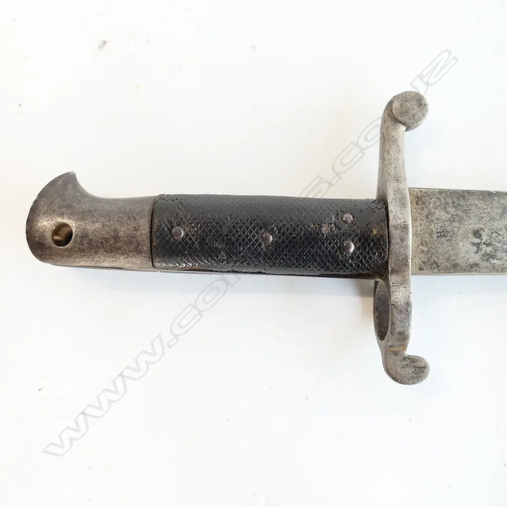 British P.1856/58 Sword Bayonet. Good leather grips. Pommel missing press-stud. Yataghan blade. Steel scabbard with one dent and one screw missing. Image 1++