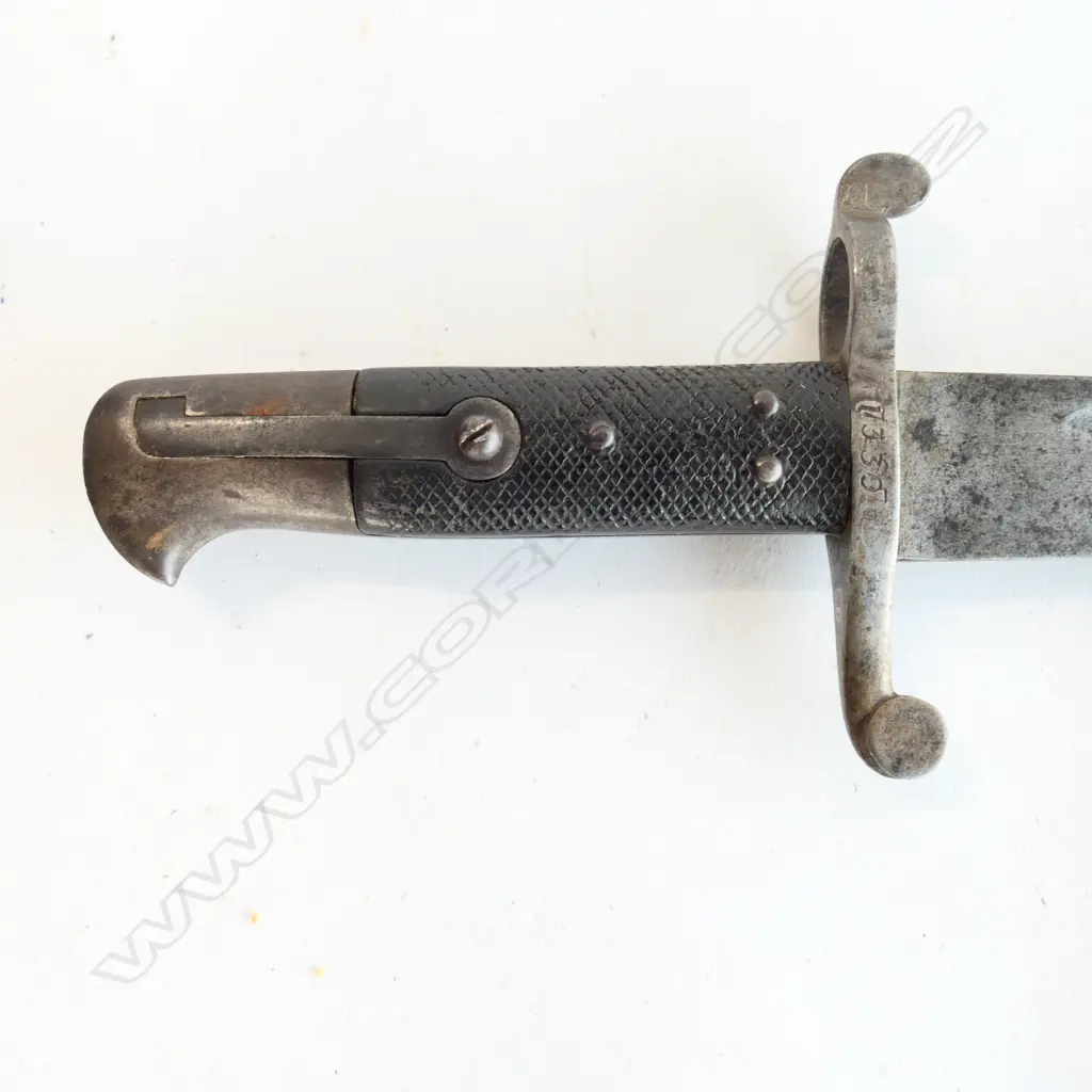 British P.1856/58 Sword Bayonet. Good leather grips. Pommel missing press-stud. Yataghan blade. Steel scabbard with one dent and one screw missing. Image 1++