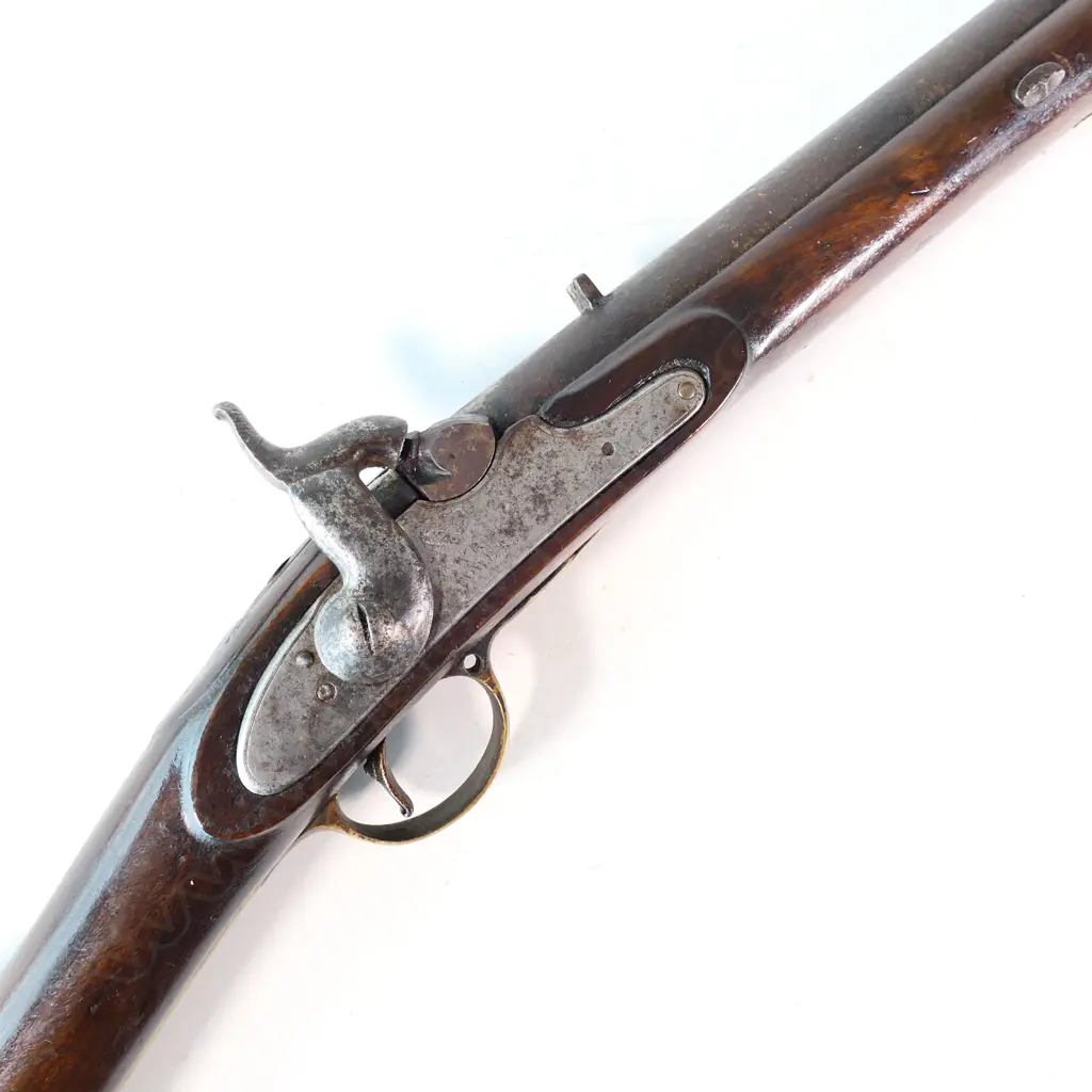 Enfield pattern 1839 percussion musket. .75 caliber, converted from Brown Bess. Brass butt plate marked broad arrow 2/65 NZ. Lock plate marked 'Crown VR Tower'. Image 1++