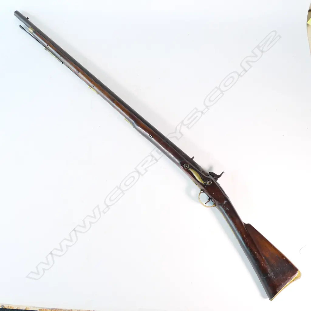 Enfield pattern 1839 percussion musket. .75 caliber, converted from Brown Bess. Brass butt plate marked broad arrow 2/65 NZ. Lock plate marked 'Crown VR Tower'. Image 1++