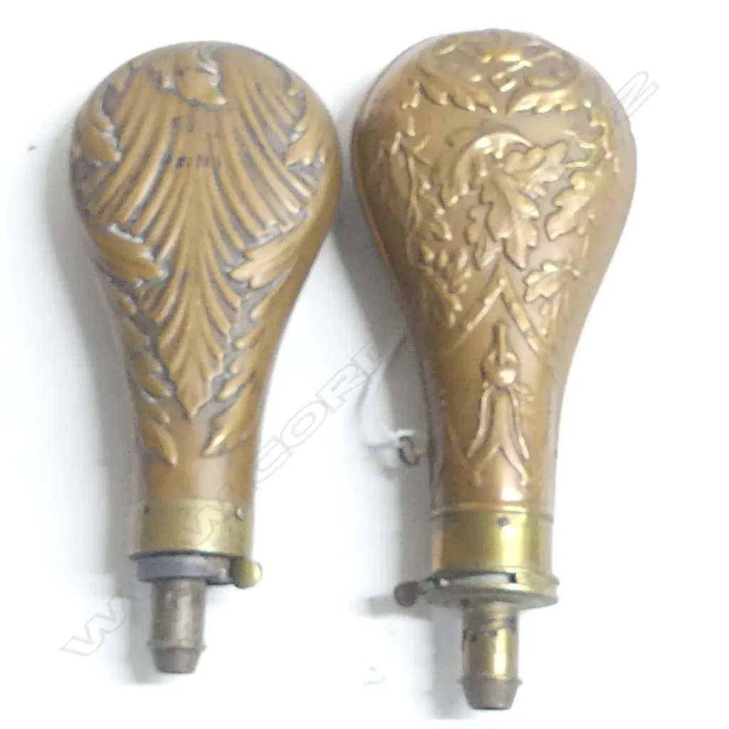 Two Victorian copper powder flasks, with graduated dispenser nozzles one decorated with oak leaves and game the other with acanthus leaves. Image 1++