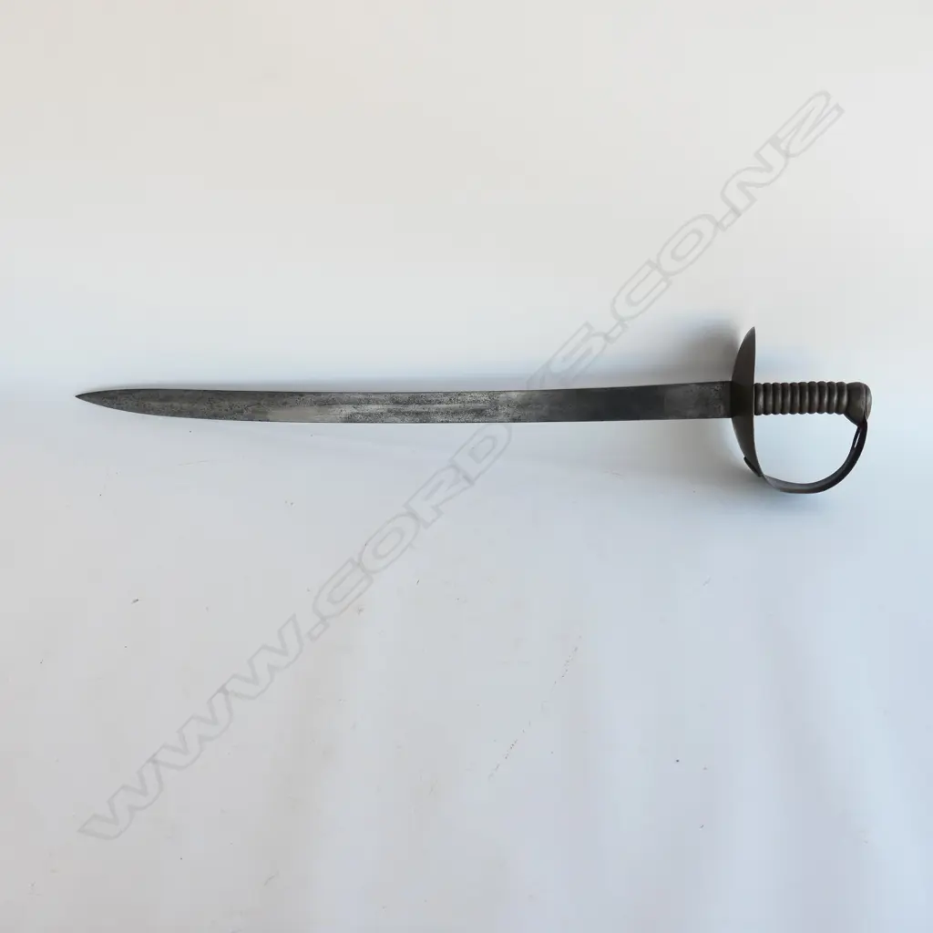An 1845 Pattern Navy Cutlass. 685mm long, single edged blade with spear point, cleaned, shortened, WD marks and "C/88" Image 1++