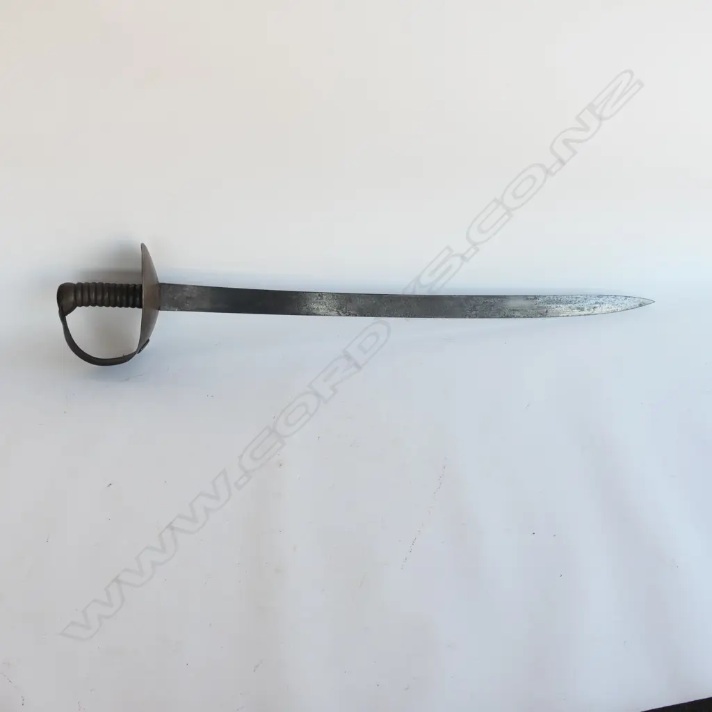 An 1845 Pattern Navy Cutlass. 685mm long, single edged blade with spear point, cleaned, shortened, WD marks and "C/88" Image 1++