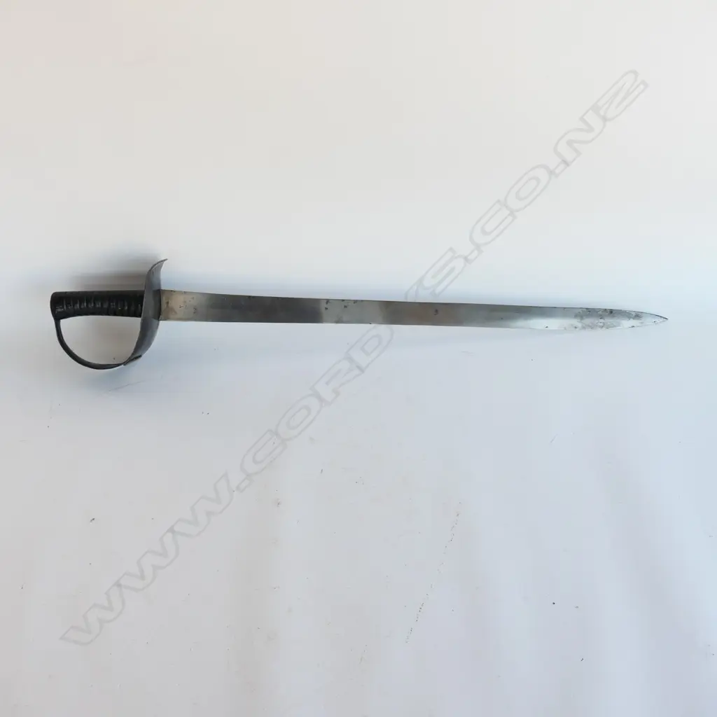 An 1845 Pattern Navy Cutlass. 635mm long, single edged blade with spear point by Robert Mole. Black painted steel bowl with diamond shaped plaque affixed marked '10' and with '53' erased, grooved cast iron grips. Mole marked to blade back, WD marks, armoury marks and C/87 at ricasso, Image 1++