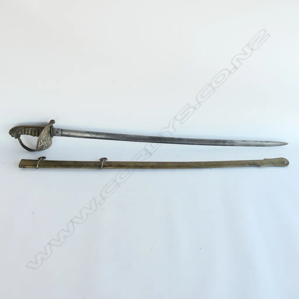 An 1827 Pattern British Naval Officer's sword with brass scabbard, the hilt with lion head pommel, Image 1++