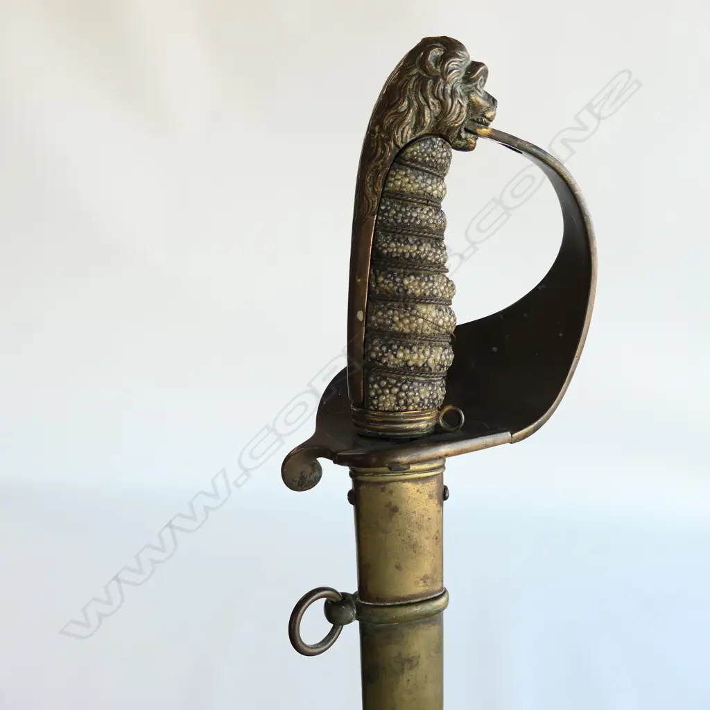 An 1827 Pattern British Naval Officer's sword with brass scabbard, the hilt with lion head pommel, Image 1++