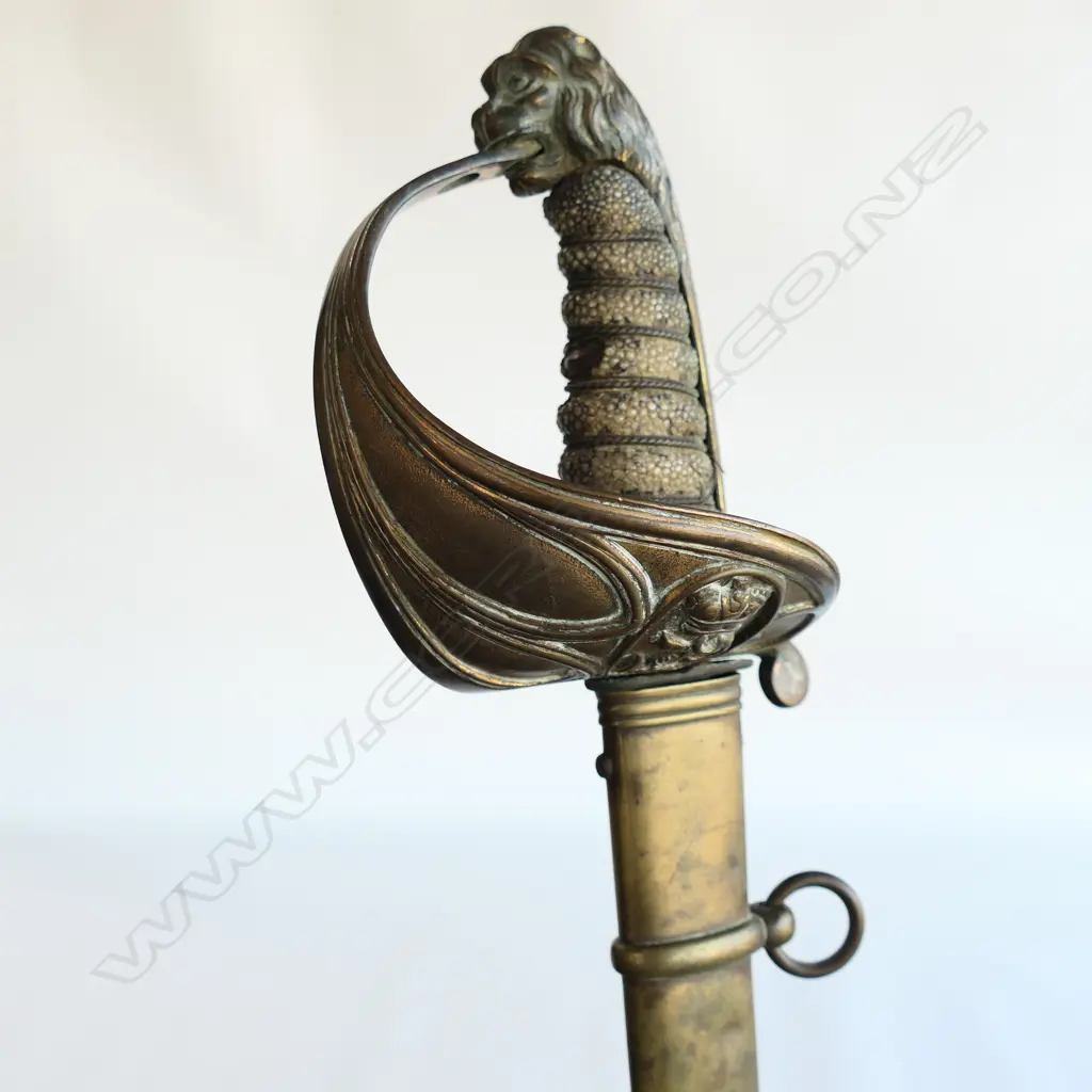 An 1827 Pattern British Naval Officer's sword with brass scabbard, the hilt with lion head pommel, Image 1++