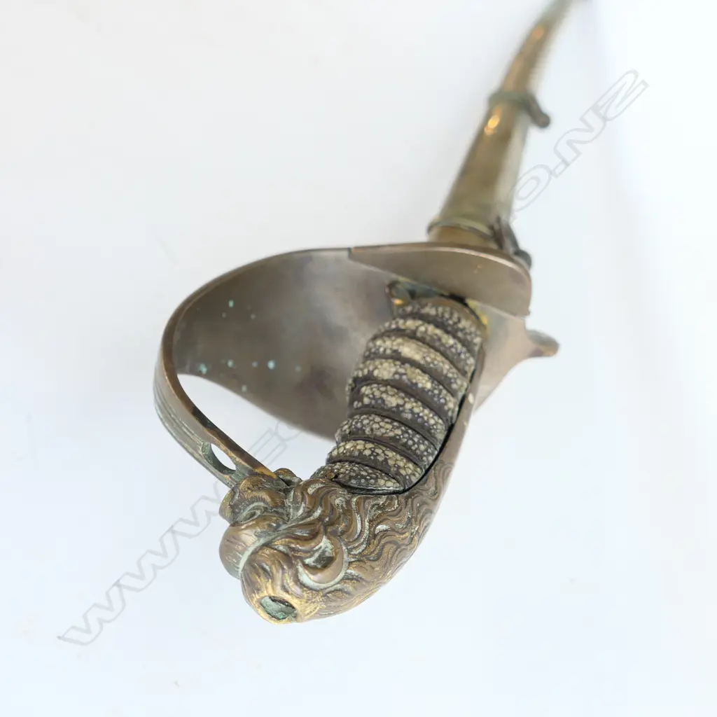 An 1827 Pattern British Naval Officer's sword with brass scabbard, the hilt with lion head pommel, Image 1++