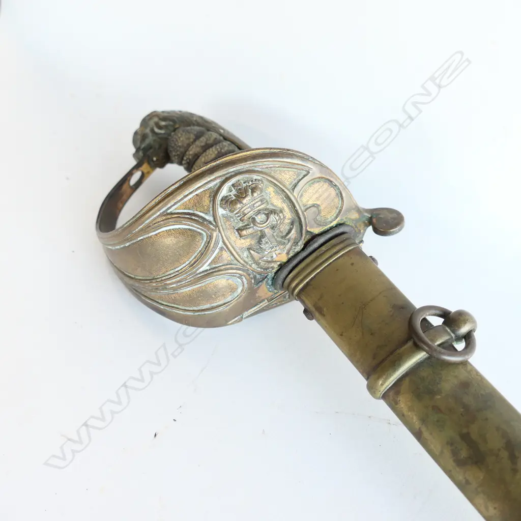 An 1827 Pattern British Naval Officer's sword with brass scabbard, the hilt with lion head pommel, Image 1++