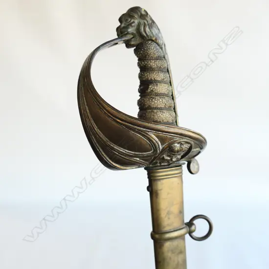 An 1827 Pattern British Naval Officer's sword with brass scabbard, the hilt with lion head pommel,