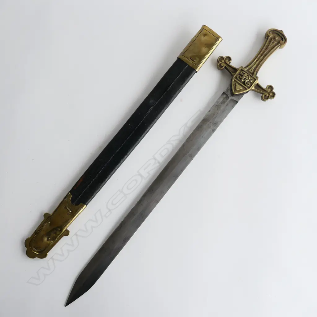 A British Drummers Pattern 1856 Sword. Clean 495mm straight double edged tapering blade, brass cruciform hilt with Victorian cypher. Stamped to side ‘9.96 RSF 13’ and matched ‘13’ to scabbard stud. Leather scabbard with brass locket and chape Image 1++