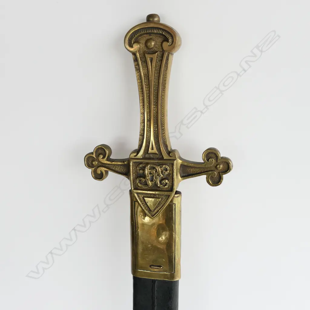 A British Drummers Pattern 1856 Sword. Clean 495mm straight double edged tapering blade, brass cruciform hilt with Victorian cypher. Stamped to side ‘9.96 RSF 13’ and matched ‘13’ to scabbard stud. Leather scabbard with brass locket and chape Image 1++