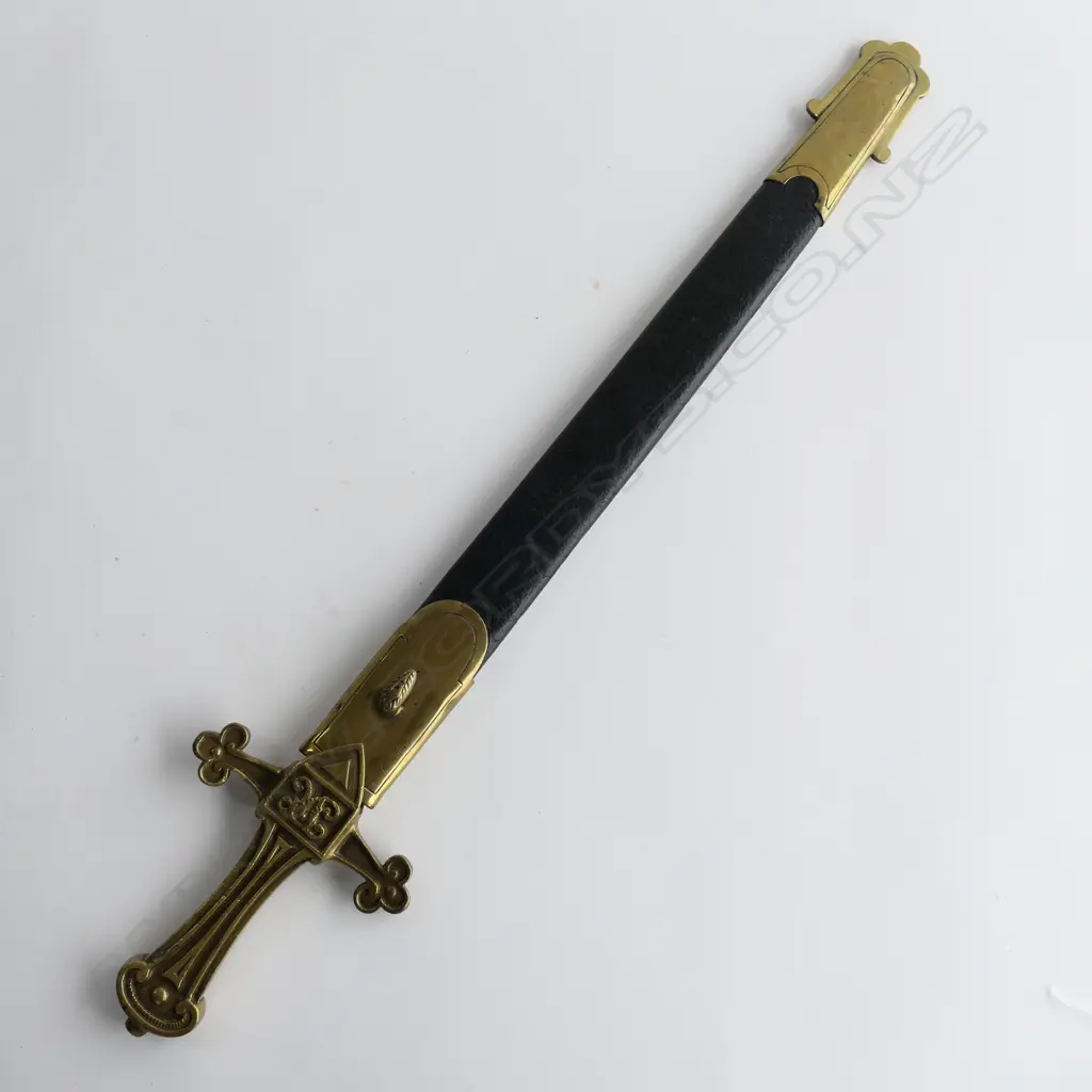 A British Drummers Pattern 1856 Sword. Clean 495mm straight double edged tapering blade, brass cruciform hilt with Victorian cypher. Stamped to side ‘9.96 RSF 13’ and matched ‘13’ to scabbard stud. Leather scabbard with brass locket and chape Image 1++