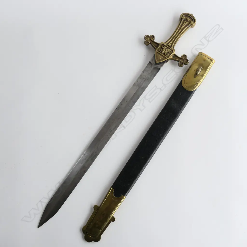 A British Drummers Pattern 1856 Sword. Clean 495mm straight double edged tapering blade, brass cruciform hilt with Victorian cypher. Stamped to side ‘9.96 RSF 13’ and matched ‘13’ to scabbard stud. Leather scabbard with brass locket and chape Image 1++