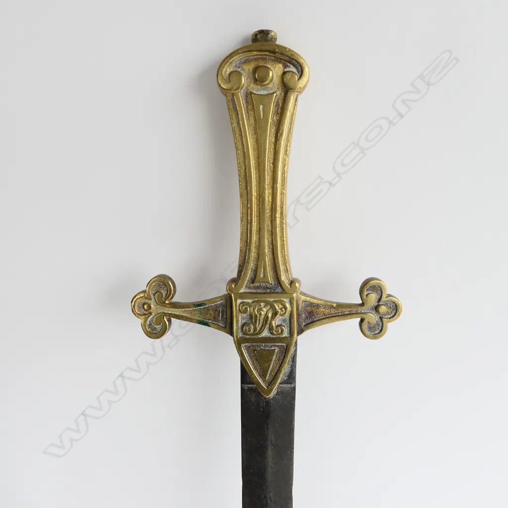 British Drummers’ Pattern 1856 Sword. 495mm slender double-edged spear point blade, brass cruciform hilt with Victorian cypher. Blade a brown patina with some pitting mainly on the point. Image 1++