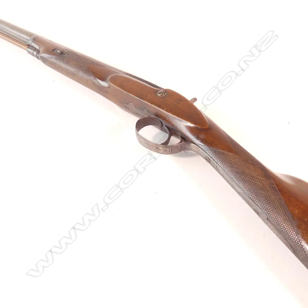 Hollis and Sheath single barrel fowling shotgun.12 gauge percussion. Attractive damascus twist pattern barrel. Wooden ramrod. Nice walnut stock with checquering to wrist and fore end. Barrel with London address line. Image 1++