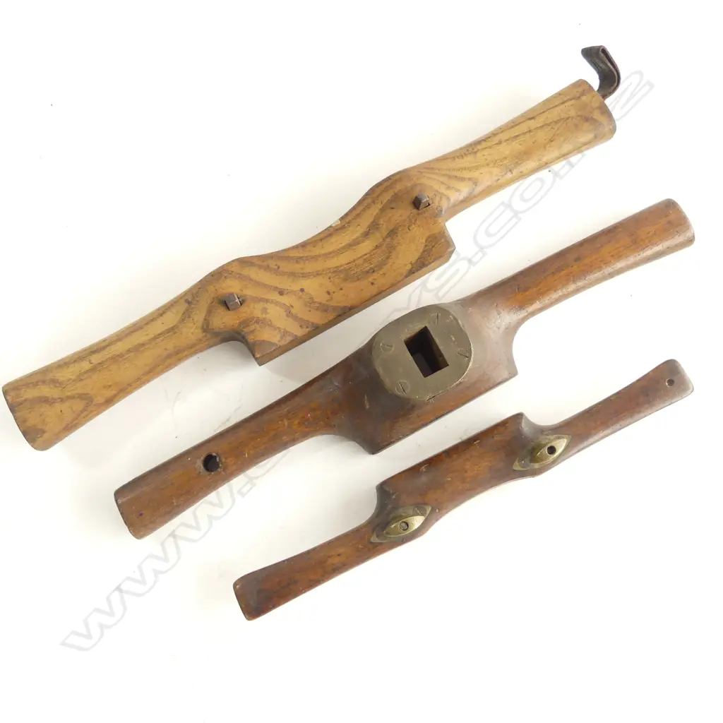 Three old wooden hand tools; oak spoke shave, beech spoke shave with brass fittings, and an oak handled router with steel sole and brass top plate fitting Image 1++