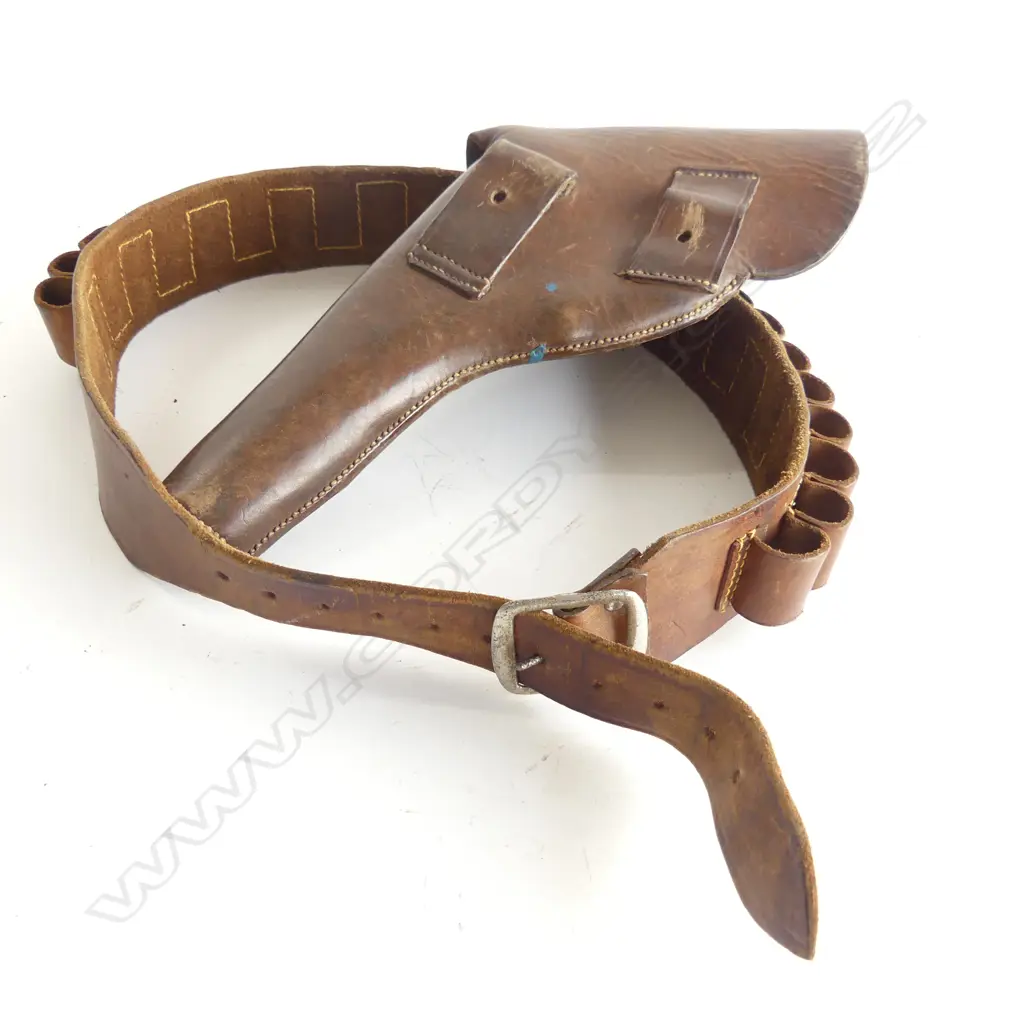 A brown leather-flap type holster with stud dome and leather strap, along with a leather belt to hold 24 cartridges. Image 1++