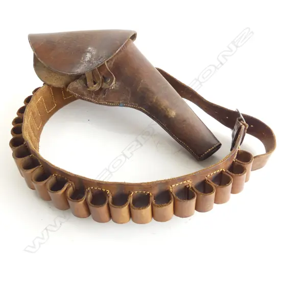 A brown leather-flap type holster with stud dome and leather strap, along with a leather belt to hold 24 cartridges.