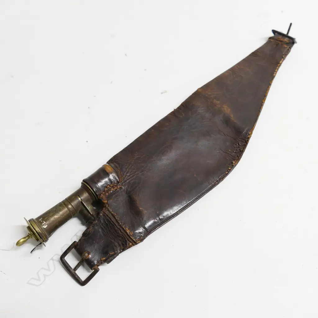 Shot charger for over shoulder by Dixon & Sons . Complete with Irish spoon charger, lacking belt section. Image 1++
