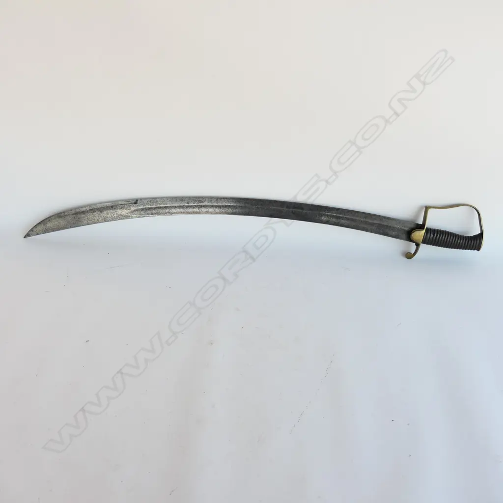 A Light Cavalry Officer’s Pattern 1796 Sabre, marked ‘Osborn’ on blade back, with brass stirrup hilt with half-round langets, iron grooved grip, single fullered 755mm blade. No scabbard Image 1++