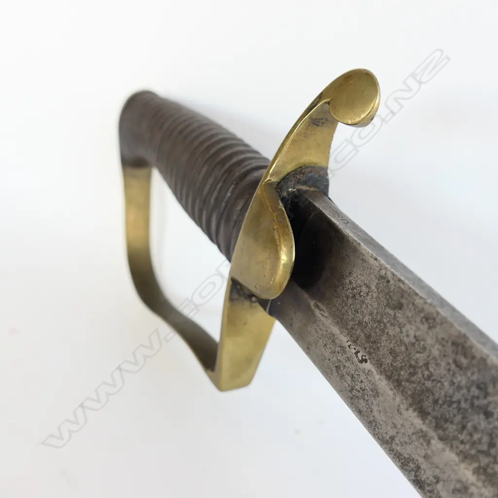 A Light Cavalry Officer’s Pattern 1796 Sabre, marked ‘Osborn’ on blade back, with brass stirrup hilt with half-round langets, iron grooved grip, single fullered 755mm blade. No scabbard Image 1++