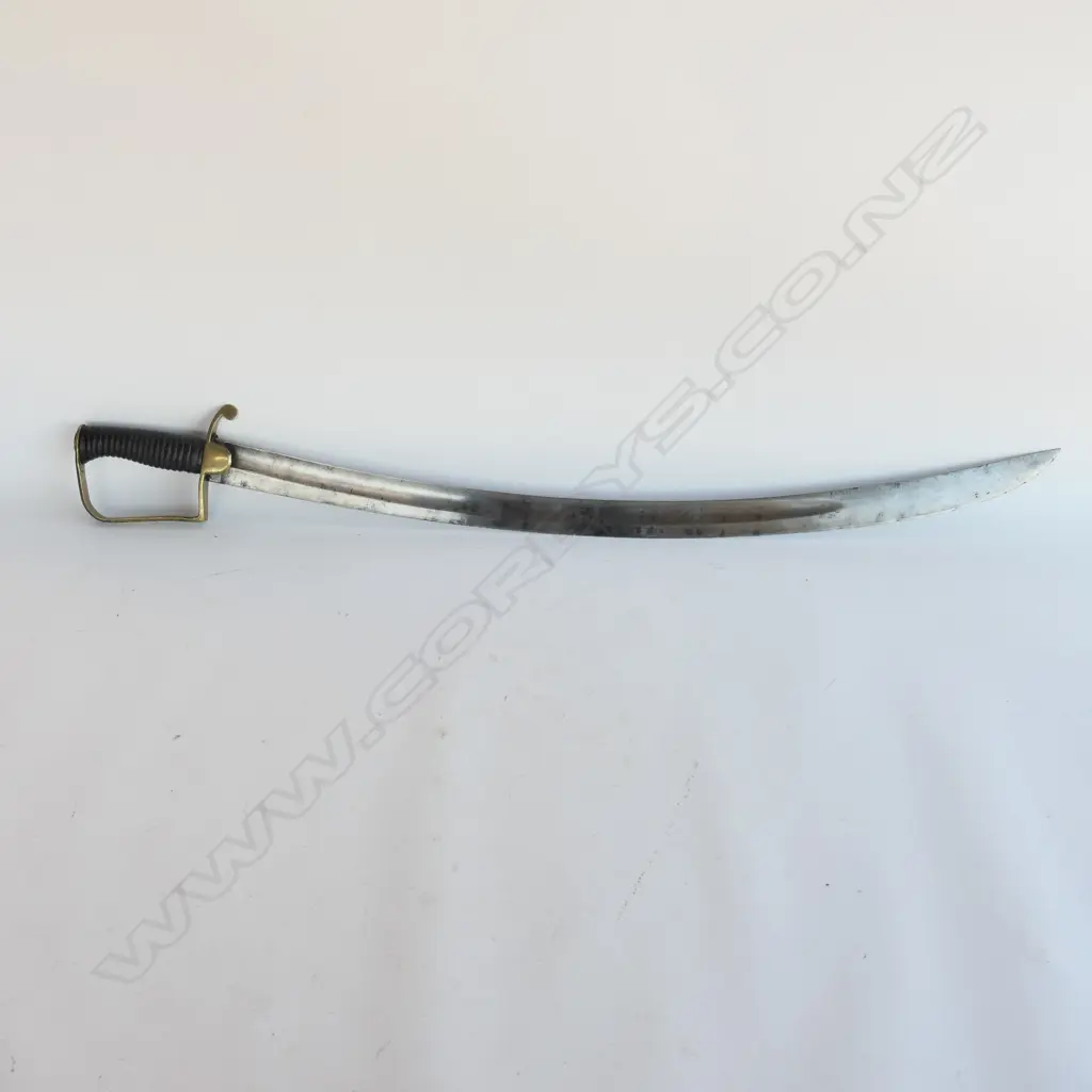 A Light Cavalry Officer’s Pattern 1796 Sabre, marked ‘Osborn’ on blade back, with brass stirrup hilt with half-round langets, iron grooved grip, single fullered 755mm blade, cleaned, edge chips. No scabbard Image 1++