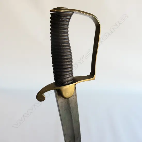 A Light Cavalry Officer’s Pattern 1796 Sabre, marked ‘Osborn’ on blade back, with brass stirrup hilt with half-round langets, iron grooved grip, single fullered 755mm blade, cleaned, edge chips. No scabbard