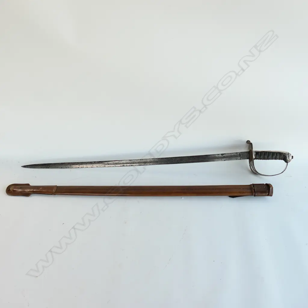 An 1845 pattern Officer's sword. As issued with very good brown leather scabbard. Nickel-plated hilt with open swept guard bugle cypher, Image 1++