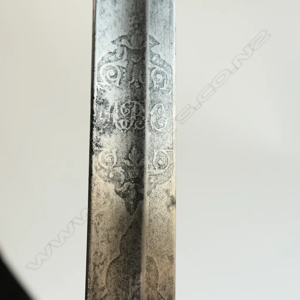 An 1845 pattern Officer's sword. As issued with very good brown leather scabbard. Nickel-plated hilt with open swept guard bugle cypher, Image 1++