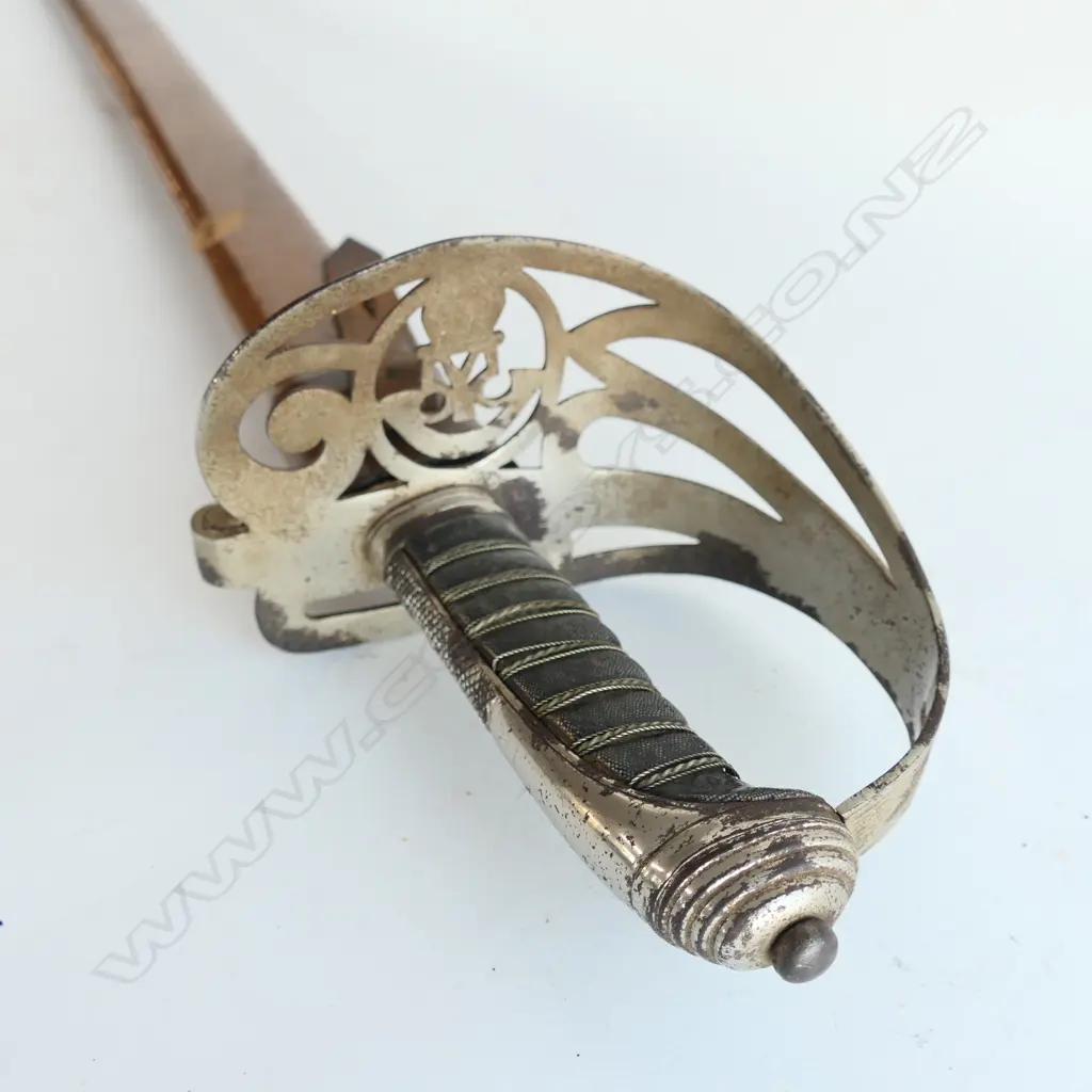 An 1845 pattern Officer's sword. As issued with very good brown leather scabbard. Nickel-plated hilt with open swept guard bugle cypher, Image 1++