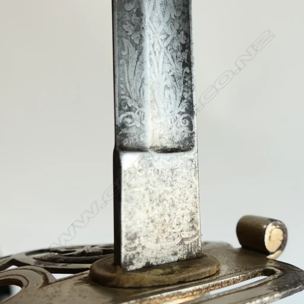 An 1845 pattern Officer's sword. As issued with very good brown leather scabbard. Nickel-plated hilt with open swept guard bugle cypher, Image 1++